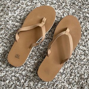 Wild Fable tan flip flops with white and pink sole detail